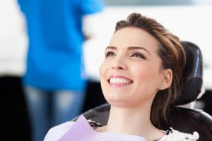 woman smiling in dentist's chair